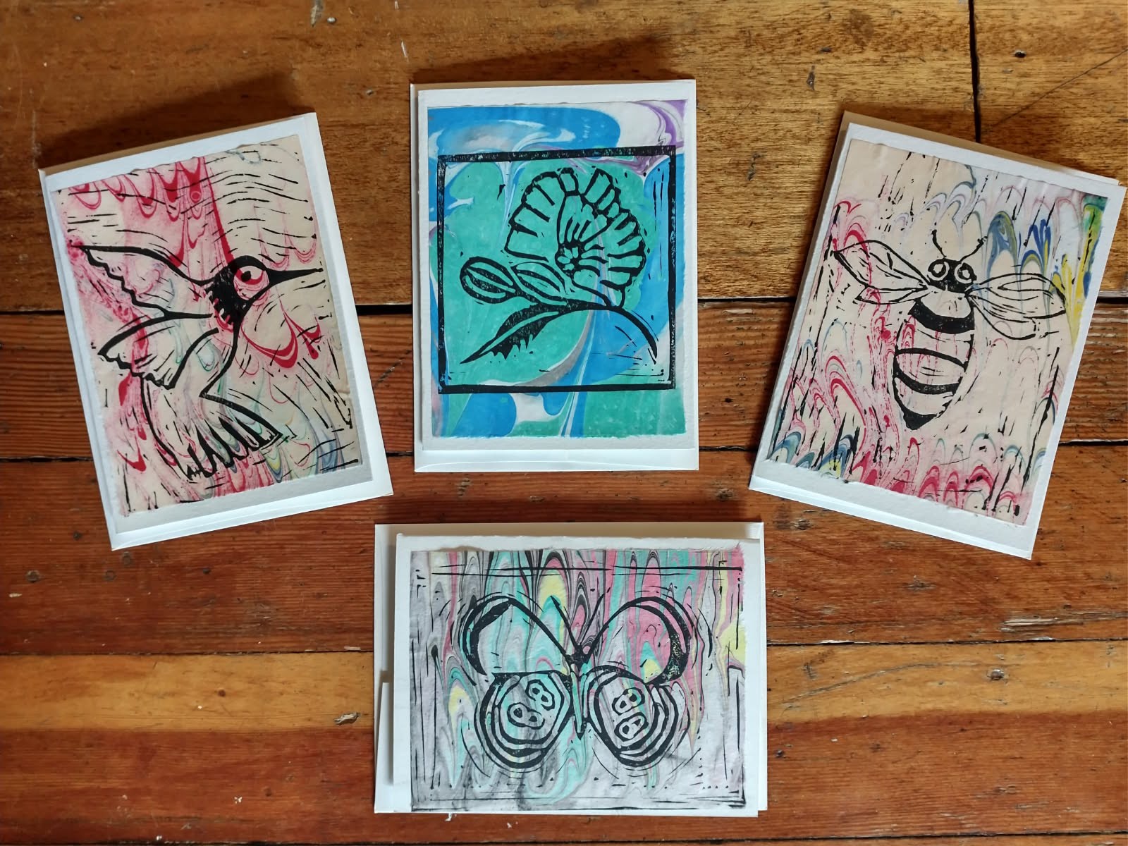 Four Block Print Cards on Hand Marbled Paper (hummingbird, poppy, bee, butterfly)